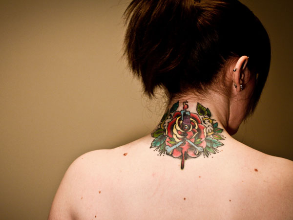 Traditional Rose Tattoo On Girl Back Neck