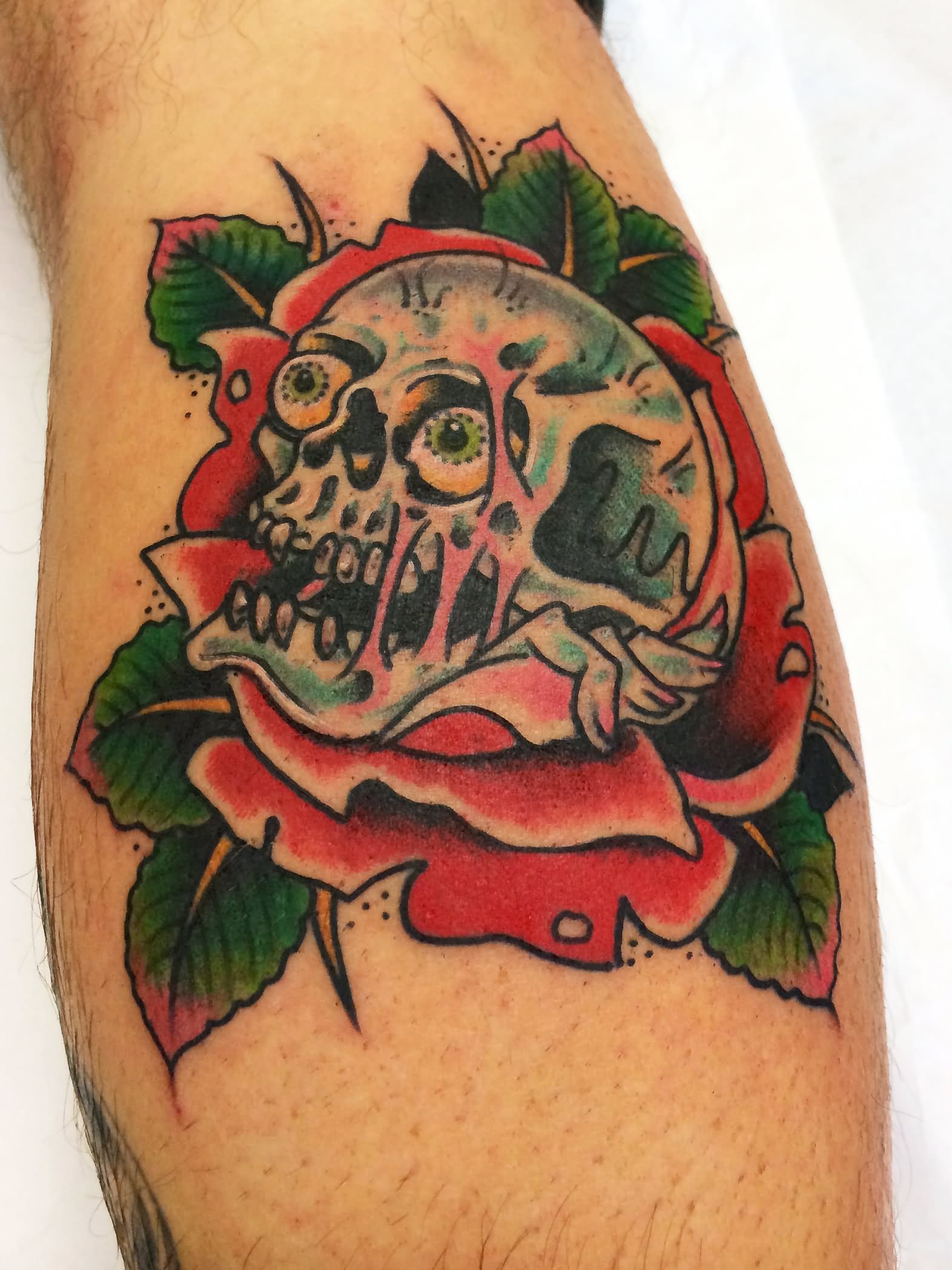 Traditional Skull With Rose Tattoo Design For Leg Calf