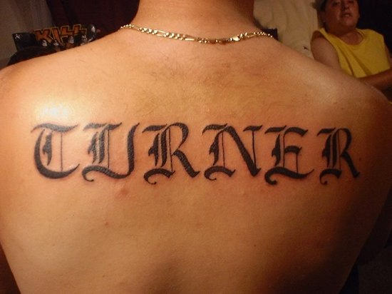 Turner Word Tattoo On Upper Back