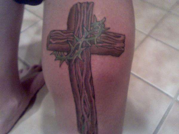Wooden Cross With Barbed Crown Tattoo On Right Leg Calf
