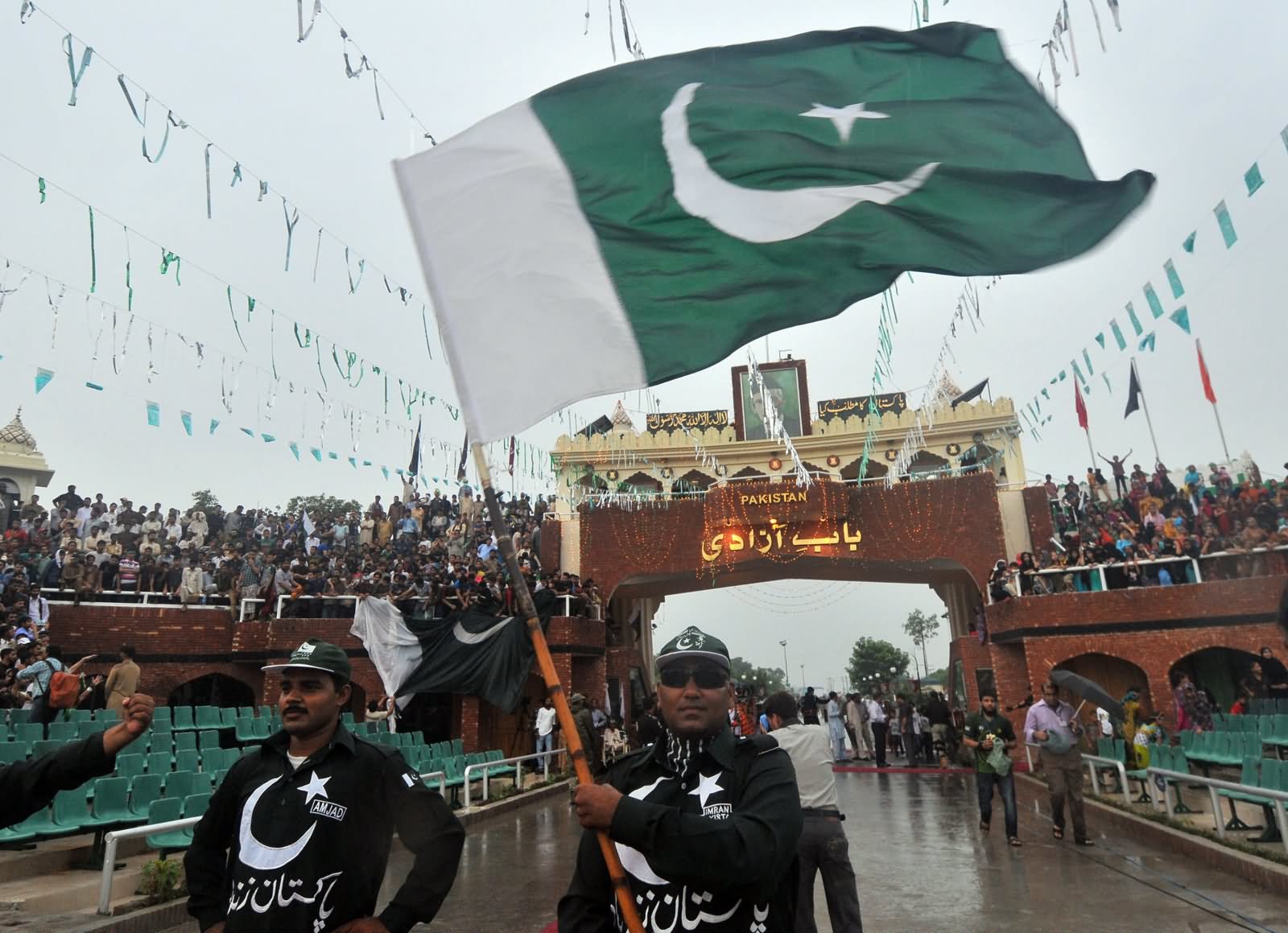 A Pakistani Man Carries National Flag Celebrating Independence Day Of Pakistan