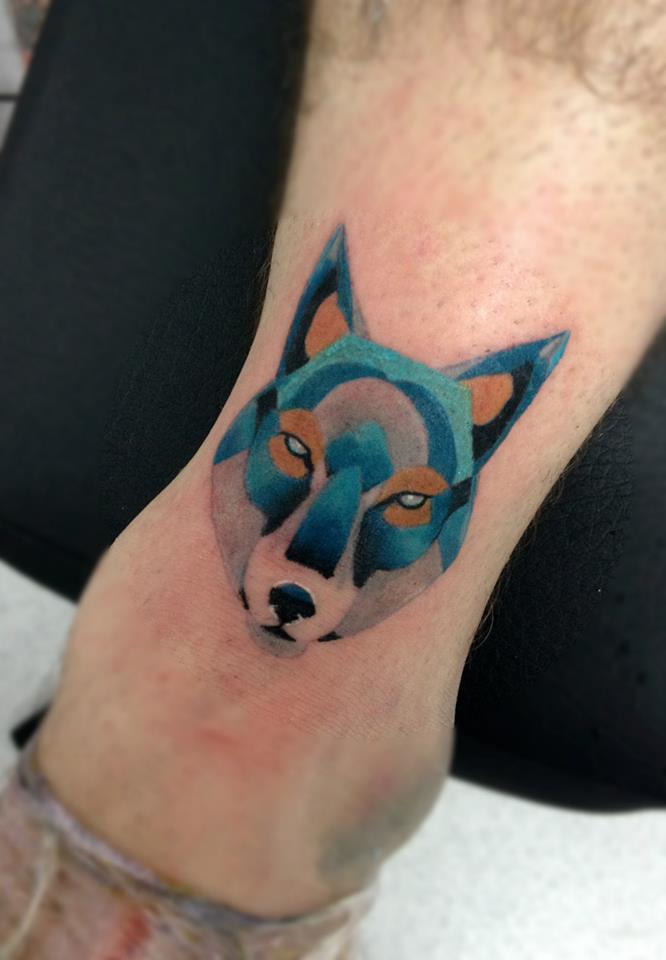 Abstract Wolf Head Tattoo On Leg by Daniel Rozo