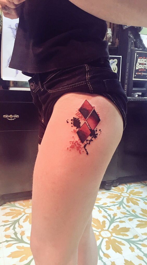 Amazing Harley Quinn Symbol Tattoo On Left Thigh