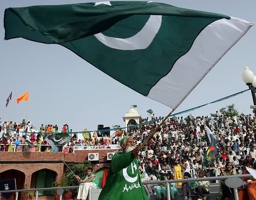 An Old Pakistani Man Waving Flag Celebrations Of The Independence Day