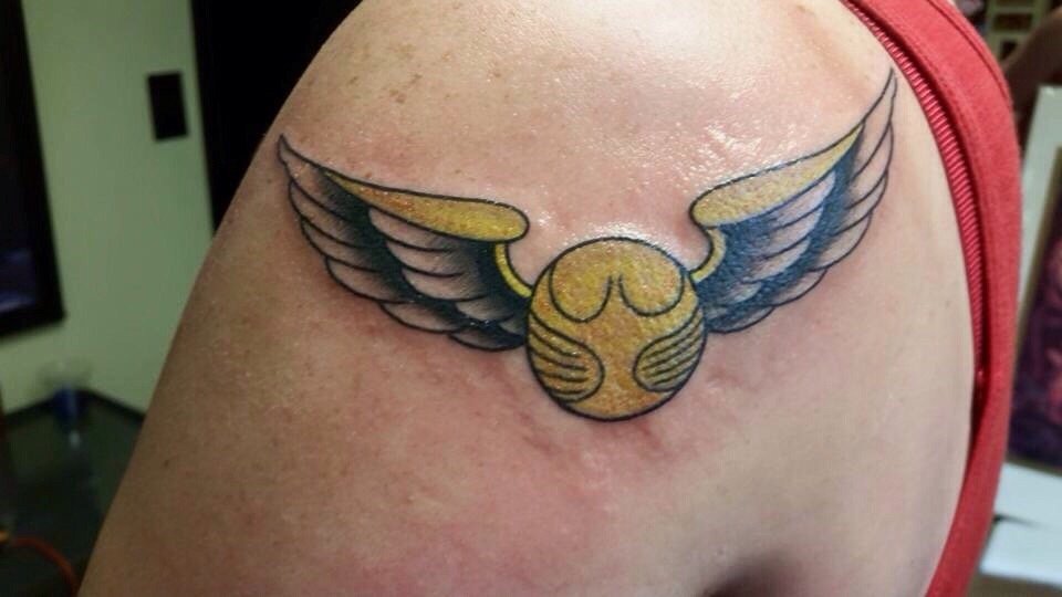 Attractive Snitch Tattoo On Left Shoulder