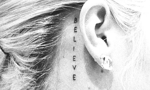 Believe Lettering Tattoo On Right Behind The Ear