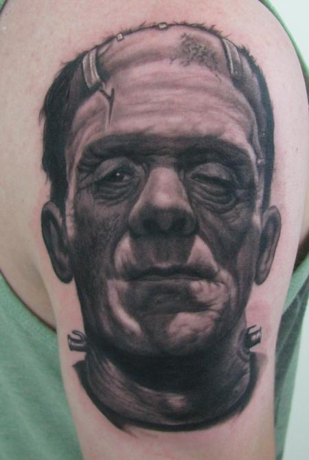 Black And Grey Frankenstein Head Tattoo Design For Shoulder By Steve Wimmer