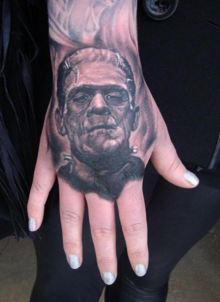 Black And Grey Frankenstein Head Tattoo On Hand