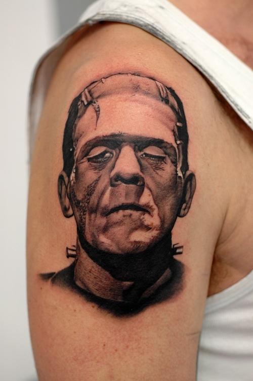 Black And Grey Frankenstein Head Tattoo On Right Shoulder