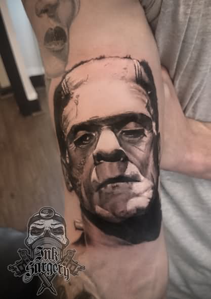 Black And Grey Frankenstein Head Tattoo On Right Sleeve