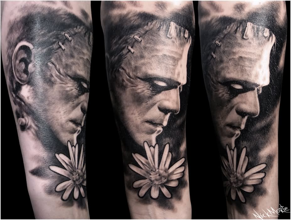 Black And Grey Frankenstein Head With Flower Tattoo Design For Full Sleeve By Nick Morte