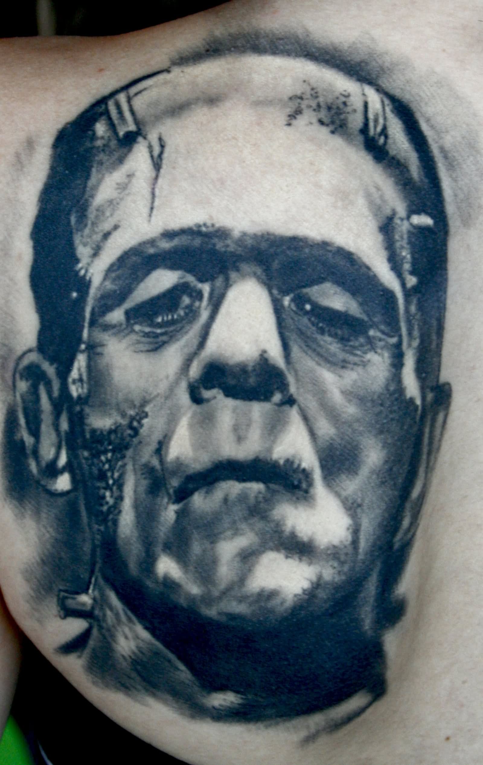 Black And Grey Frankenstein Tattoo On Left Back Shoulder
