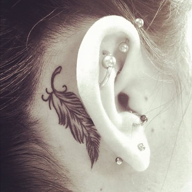 Black Feather Tattoo On Right Behind The Ear