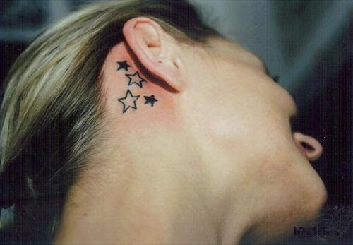 Black Four Stars Tattoo On Girl Right Behind The Ear