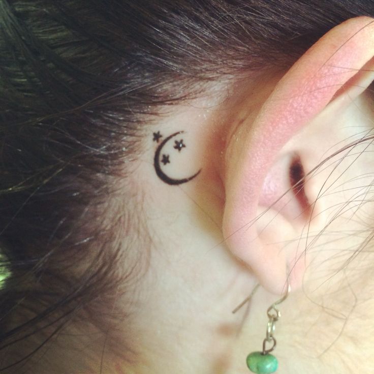Black Half Moon With Stars Tattoo On Girl Right Behind The Ear