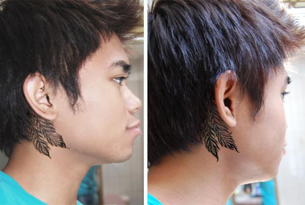 Black Ink Feathers Tattoo On Boy Right Behind The Ear