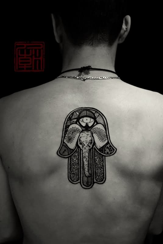 Black Ink Hamsa Elephant Tattoo On Man Upper Back
