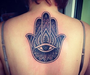 Black Ink Hamsa Tattoo On Girl Upper Back