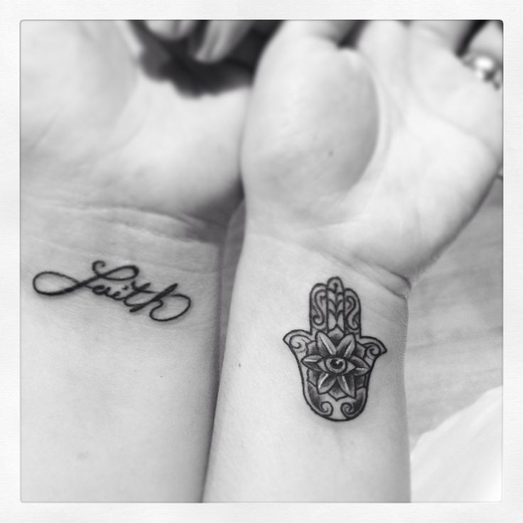 Black Ink Hamsa Tattoo On Left Wrist