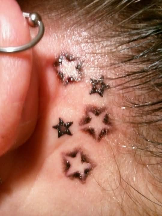 Black Ink Stars Tattoo On Behind The Ear