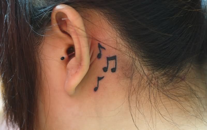 Black Music Knots Tattoo On Girl Left Behind The Ear