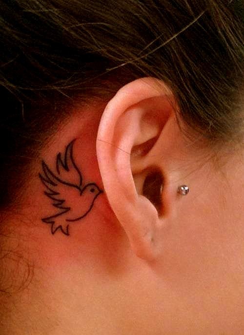 Black Outline Bird Tattoo On Right Behind The Ear