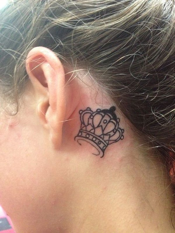 Black Outline Crown Tattoo On Girl Left Behind The Ear