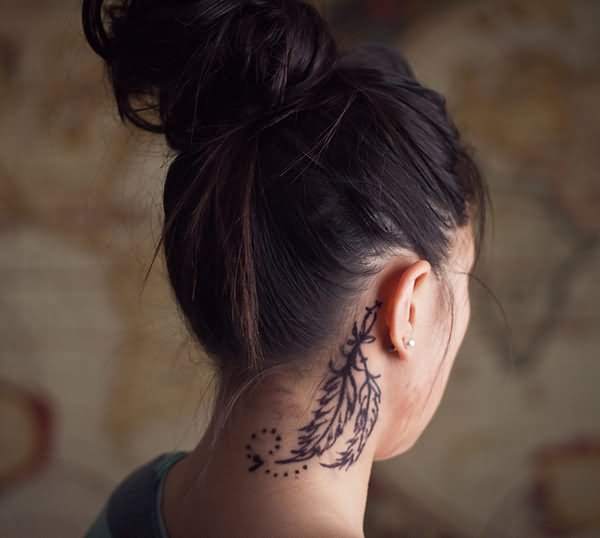 Black Outline Feathers Tattoo On Girl Right Behind The Ear