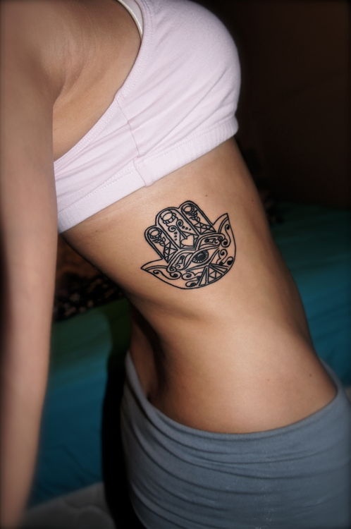 Black Outline Hamsa Tattoo On Girl Right Side Rib