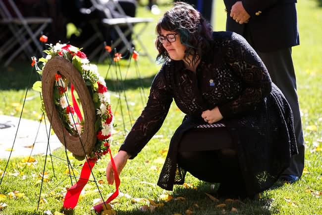 Claire Woodall Lays Wreath For Husband Cst. Daniel Woodall During Peace Officers Memorial Day