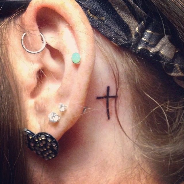 Classic Cross Tattoo On Girl Left Behind The Ear