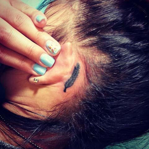 Classic Feather Tattoo On Girl Left Behind The Ear