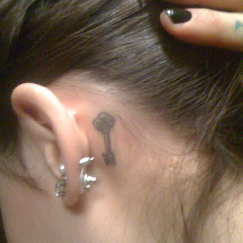 Classic Key Tattoo On Girl Left Behind The Ear