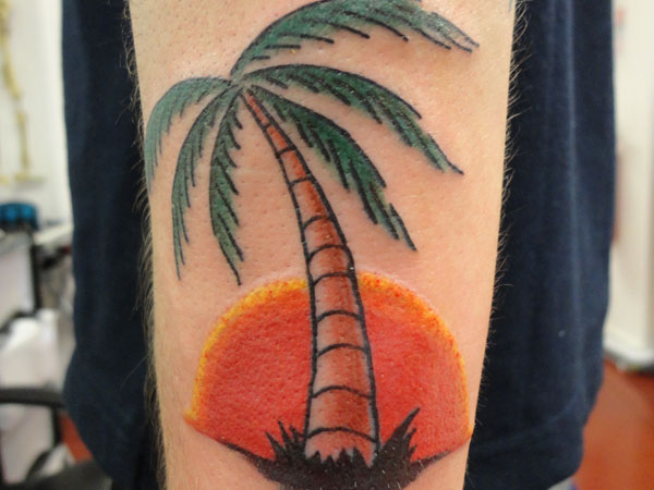 Colored Palm Tree Tattoo On Left Sleeve