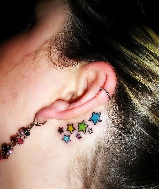 Colorful Stars Tattoo On Left Behind The Ear