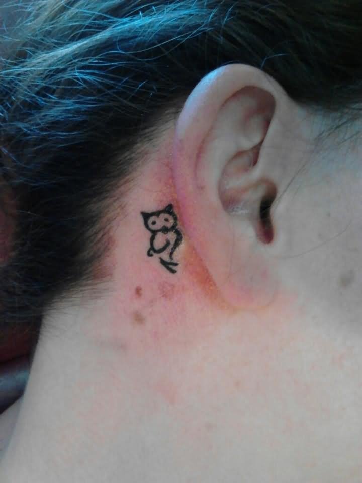Cool Black Outline Owl Tattoo On Right Behind The Ear