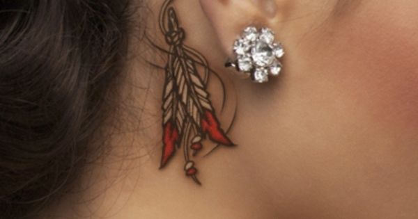 Cool Feathers Tattoo On Girl Right Behind The Ear