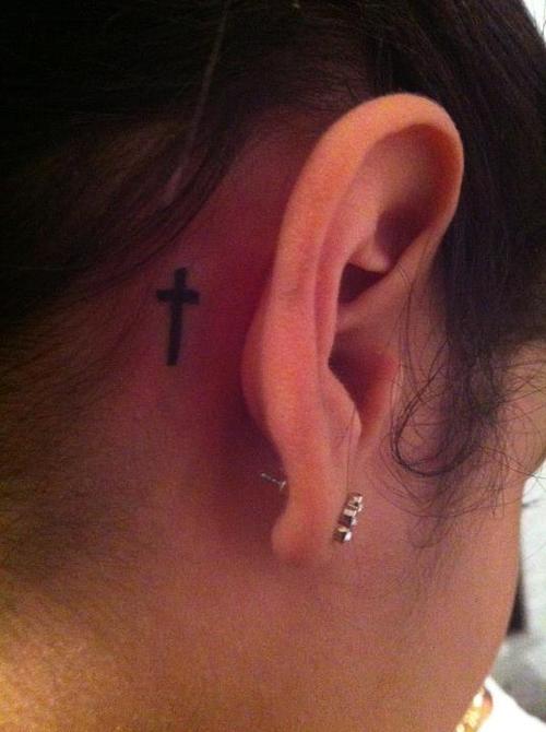 Cross Tattoo On Right Behind The Ear