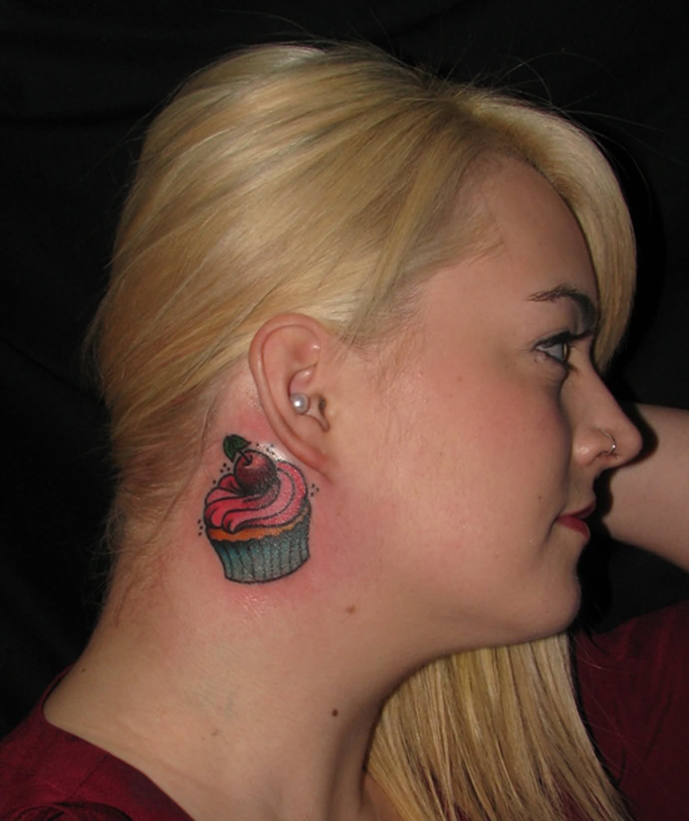 Cupcake Tattoo On Girl Right Behind The Ear