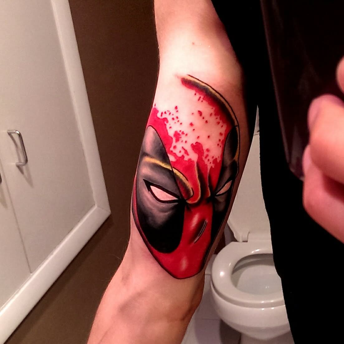 Deadpool Head Tattoo On Right Bicep