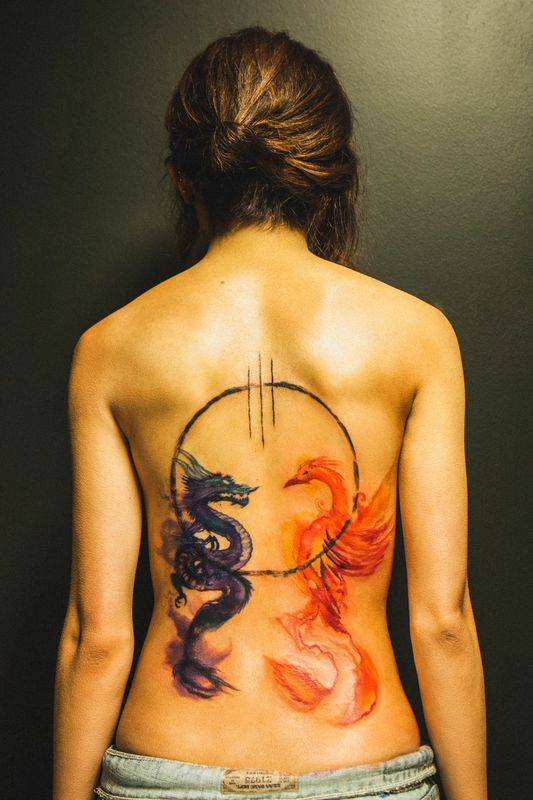 Dragon And Phoenix Tattoo On Girl Back Body