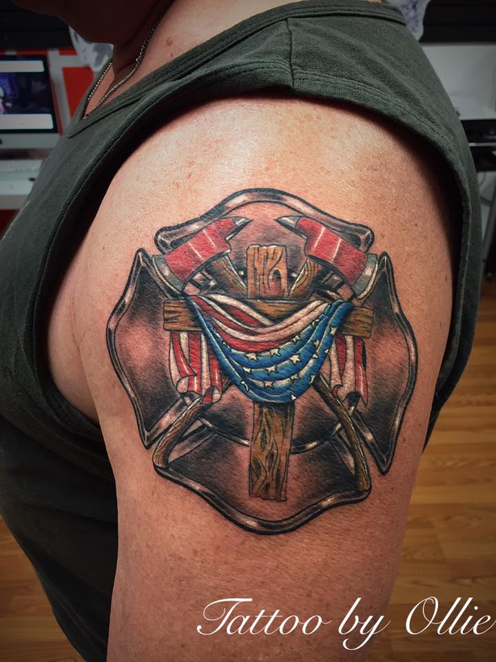 Firefighter Logo With Cross Tattoo On Left Shoulder by Oliver Venegas