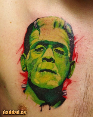 Green Ink Frankenstein Head Tattoo On Man Chest By Christofer Sagie