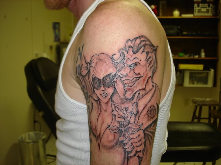 Grey Ink Joker Harley Quinn Tattoo On Left Sleeve
