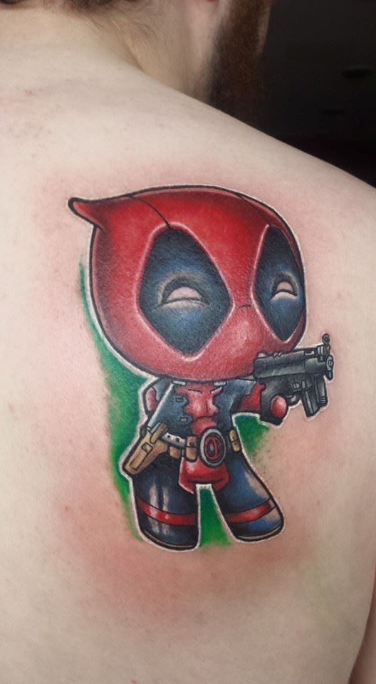 Gun In Baby Deadpool Hand Tattoo On Right Back Shoulder