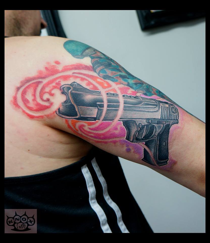 Gun Tattoo On Right Bicep by Marco Knox