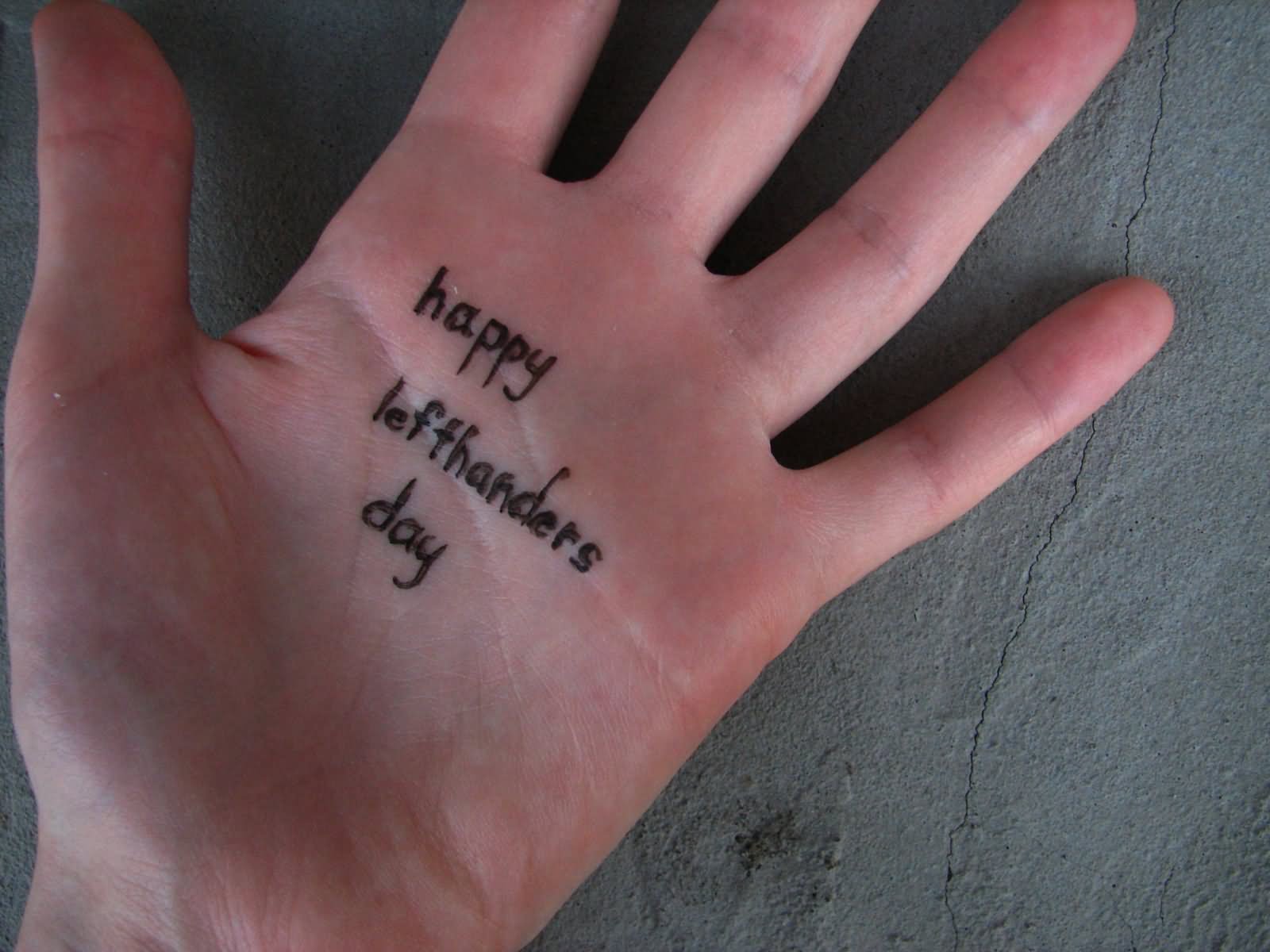 Happy Left Handers Day Tattoo On Hand Palm