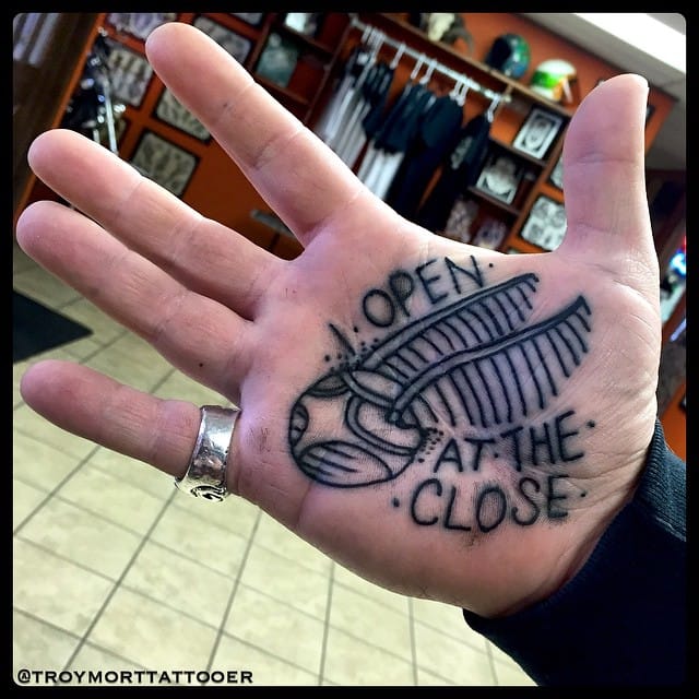 I Open At The Close - Black Outline Snitch Tattoo On Hand Palm By Troy Mort