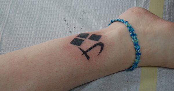 Joker And Harley Quinn Symbol Tattoo On Leg
