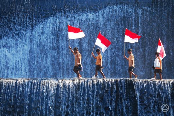 Kids With Indonesian Flags Crossing A Waterfall Happy Independence Day Of Indonesia